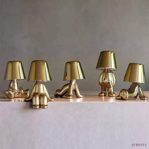 Innowacyjna lampa Thinker w kształcie postaci złotej lub chromowanej