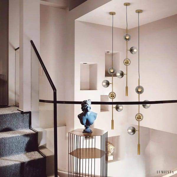 Lampa wisząca Orb w stylu industrialnym z kulistymi kloszami