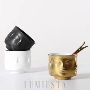 Ceramiczna doniczka w kształcie twarzy złoto-czarna