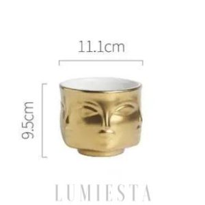 Ceramiczna doniczka w kształcie twarzy złoto-czarna