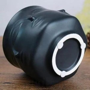 Ceramiczna doniczka w kształcie twarzy złoto-czarna