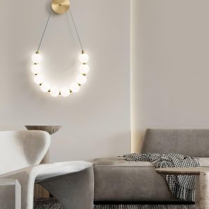 Necklace Loop - Elegancka lampa ścienna z mosiądzu