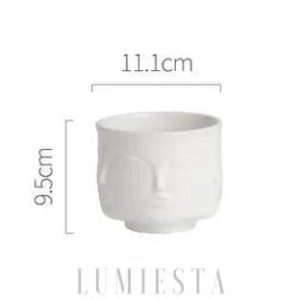 Ceramiczna doniczka w kształcie twarzy złoto-czarna