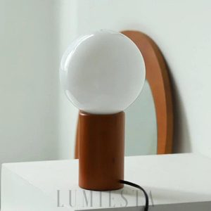 Nowoczesna lampa stołowa z okrągłym kloszem i stojakiem