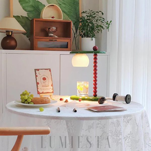 Nowoczesna lampa stołowa Everalda z podgrzewaczem świec